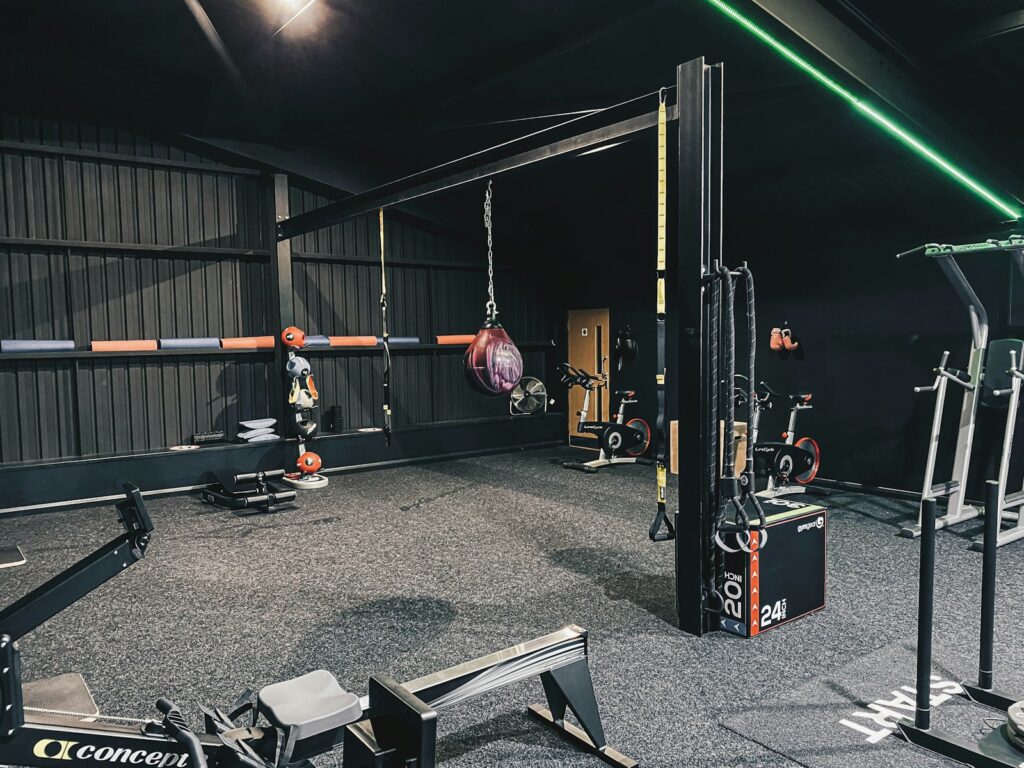 a gym filled with different types of exercise equipment