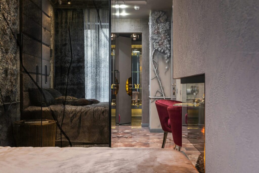 Stylish interior of a cozy modern bedroom with chic decor and warm lighting.