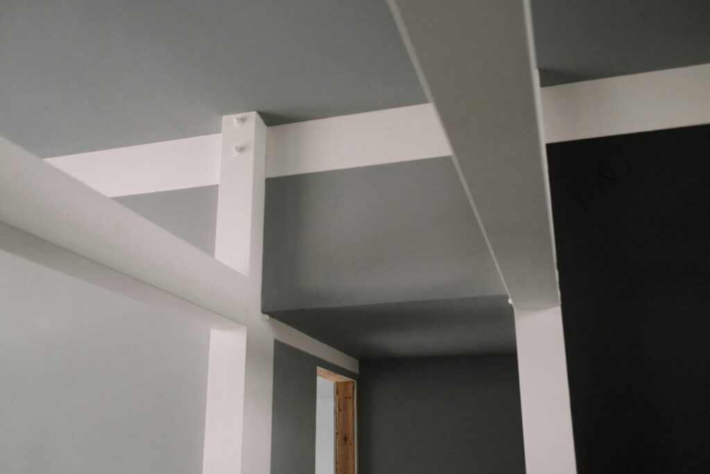 Close-up view of modern ceiling beams showcasing architectural design.