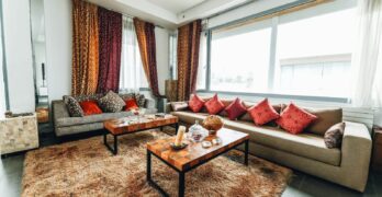 Stylish living room with contemporary furniture, colorful curtains, and cozy atmosphere, perfect for modern home interiors.
