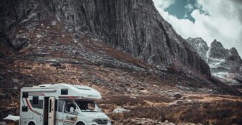 Experience travel freedom in a campervan with stunning mountain landscapes and rugged terrain.
