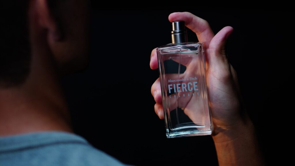A man sprays "fierce" perfume.
