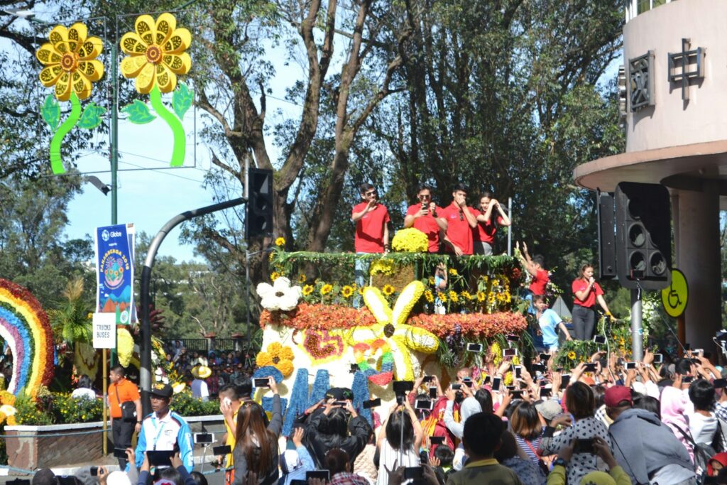 a group of people standing on top of a float