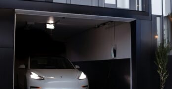 a white car is parked in a garage