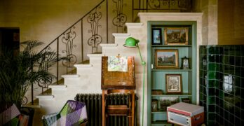 a room filled with furniture and a staircase
