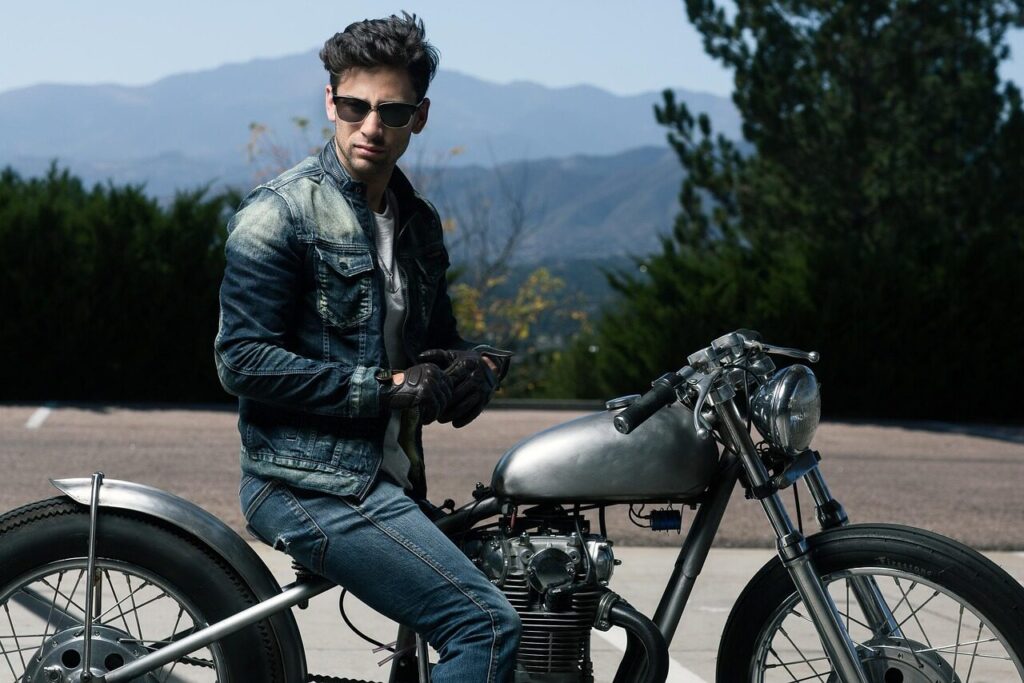 action, adult, adventure, bike, biker, cyclist, fun, glasses, gloves, leisure, man, motorcycle, mountains, outdoors, people, recreation, road, sitting, transportation system, nature, travel, vehicle, wheel, woman