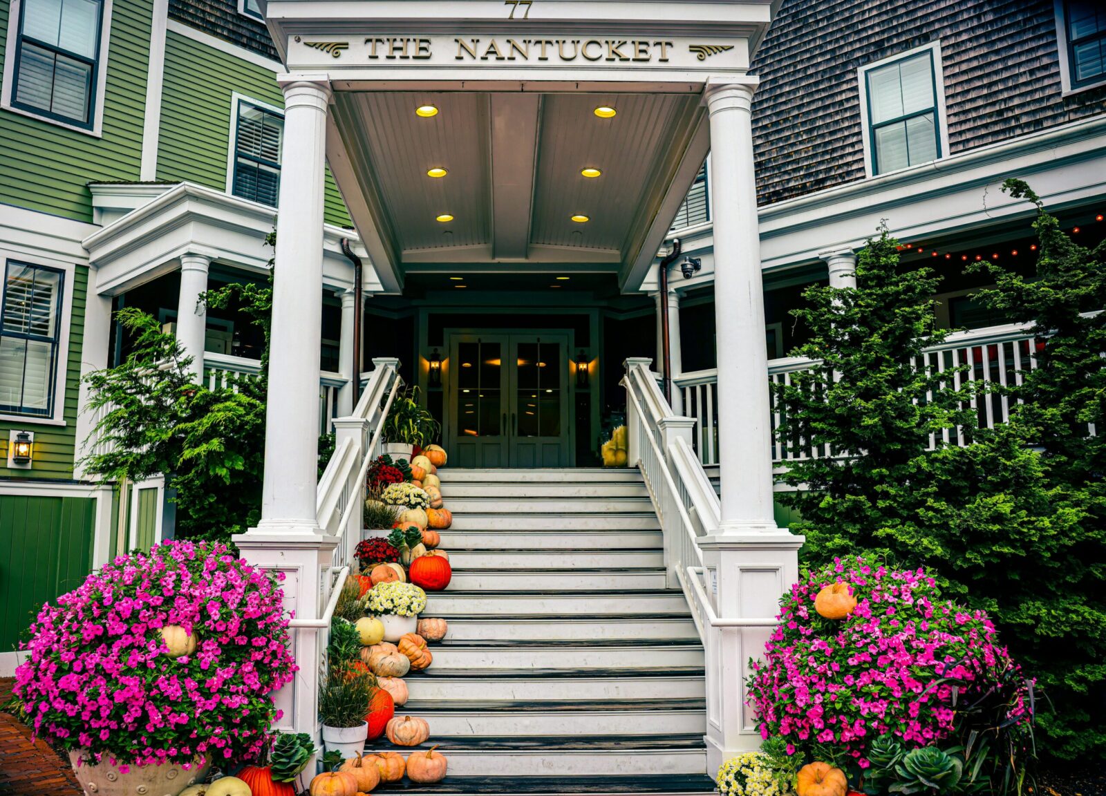 Inviting staircase decorated with pumpkins in Nantucket during fall season.