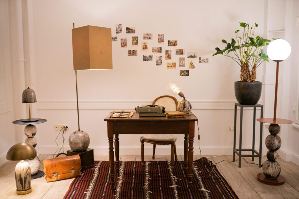 Stylish home office featuring a typewriter and artistic decor with a cozy ambiance.