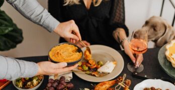 A cozy dinner scene featuring a variety of delicious dishes and a relaxing atmosphere.