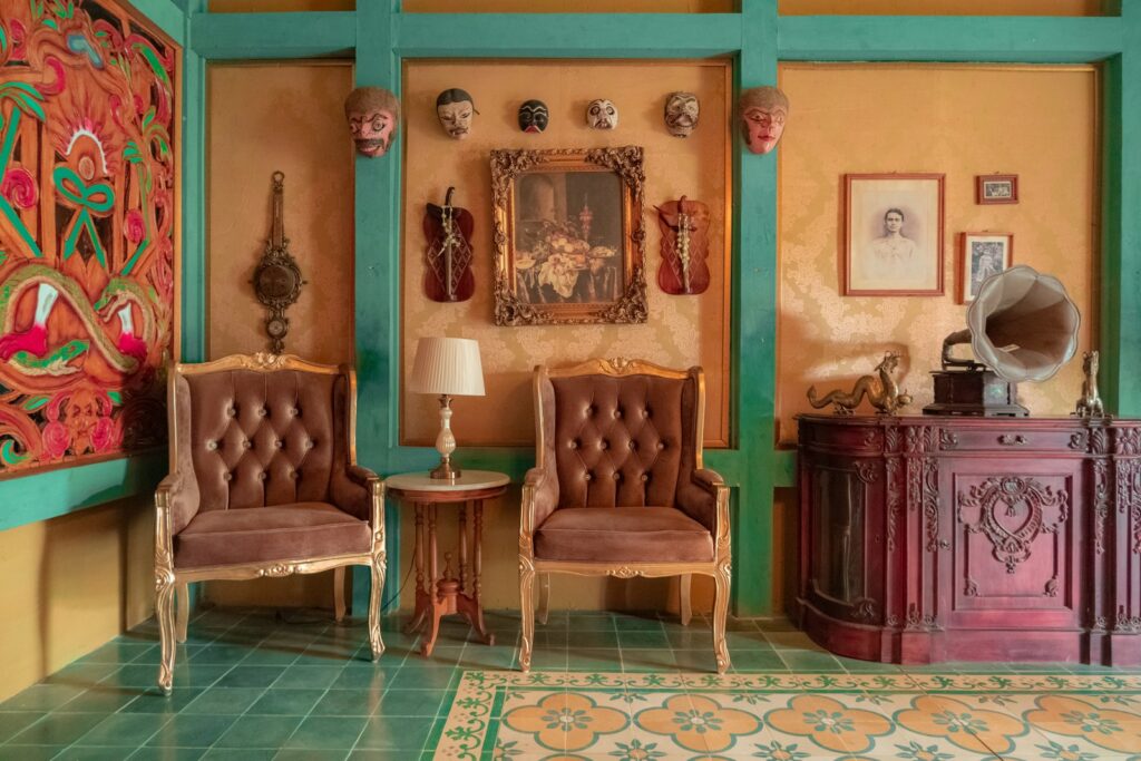 a room with two chairs and a mirror