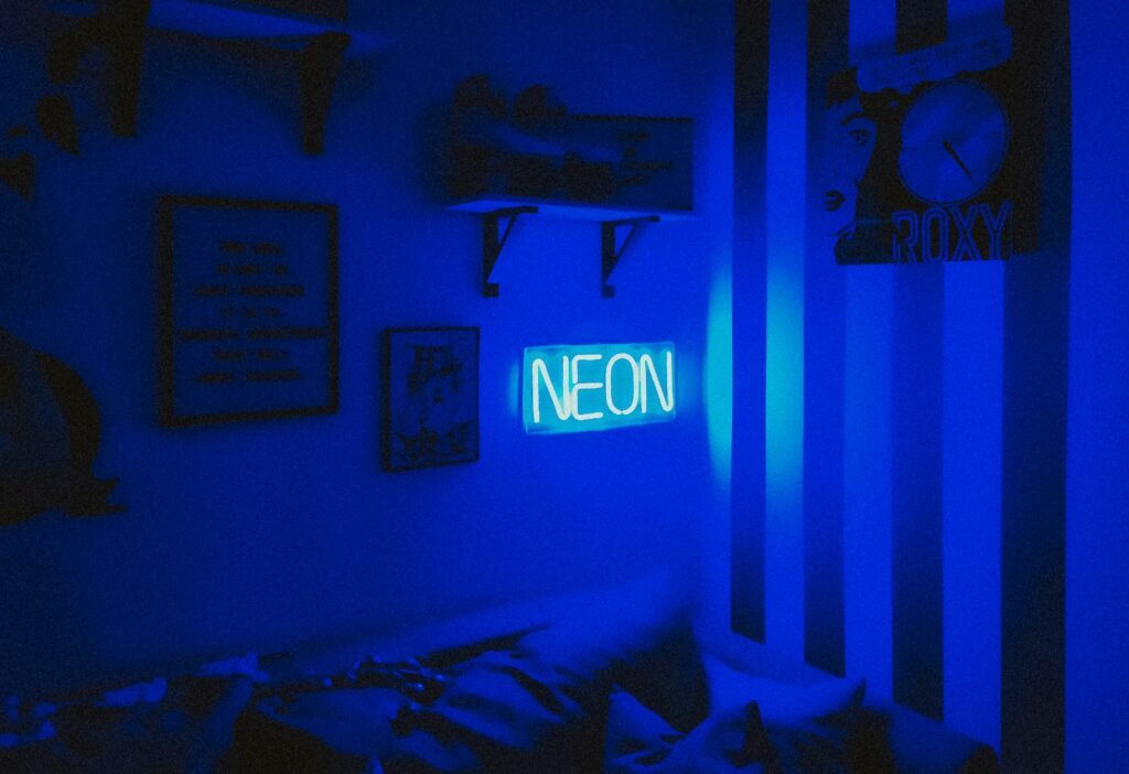 blue and white love neon light signage