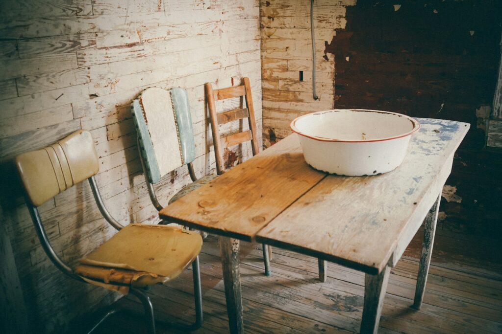 A wooden table with a bowl on top of it