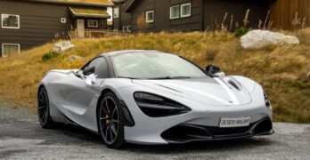 gray sports coupe parking during daytime
