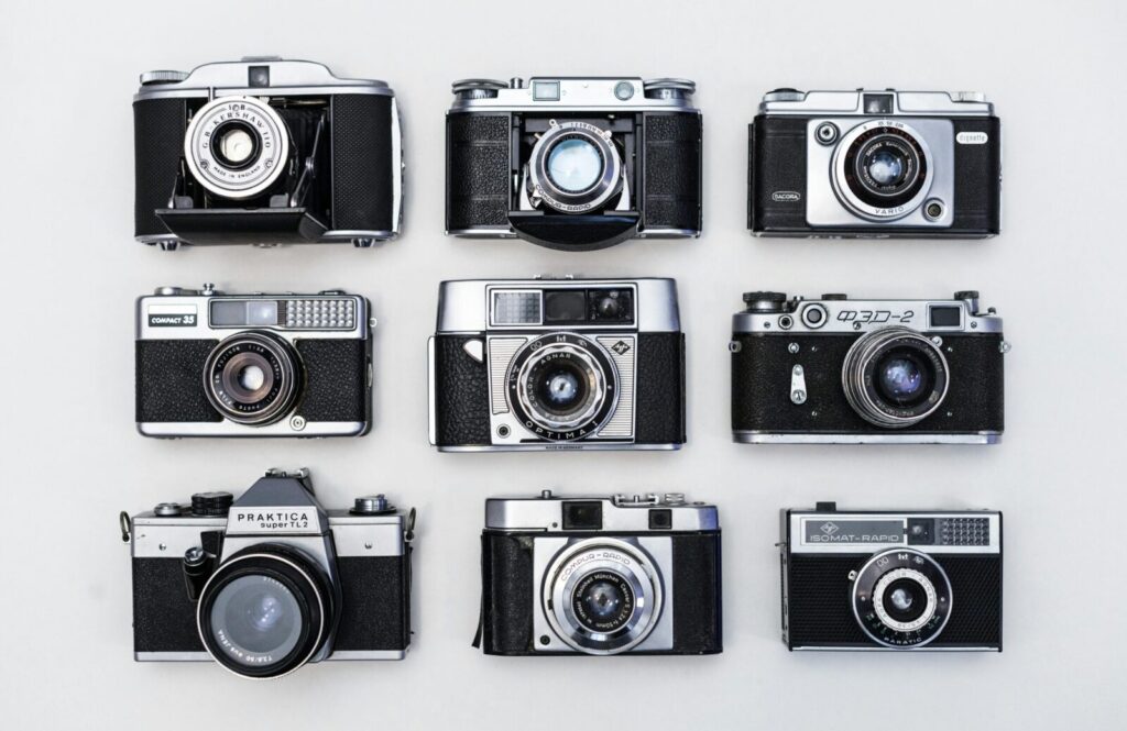 A flat lay of various vintage cameras showcasing classic photographic equipment.