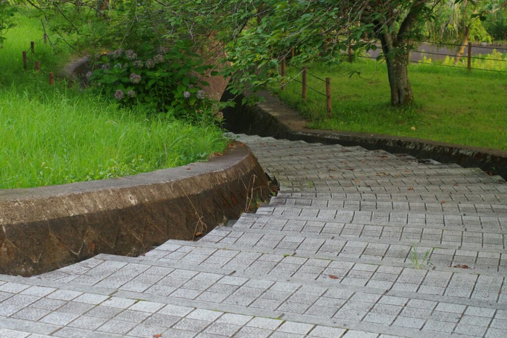 A red fire hydrant sitting on top of a brick walkway