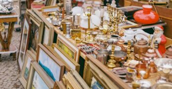 gold and silver trophy on brown wooden shelf