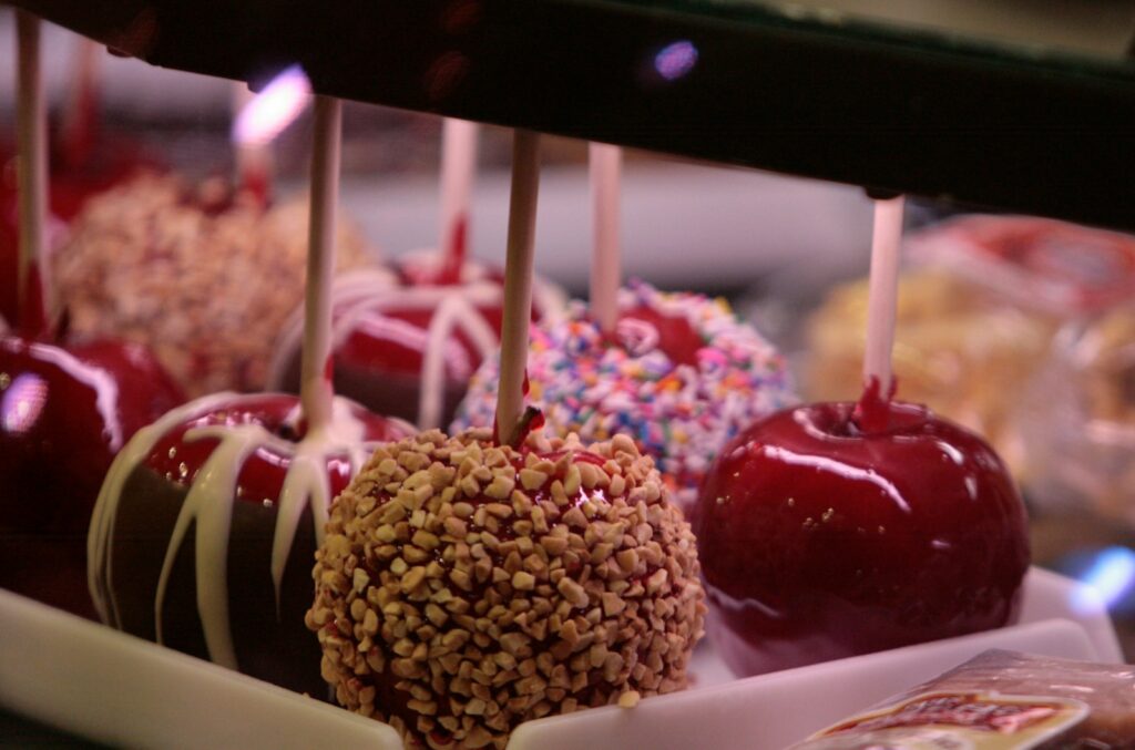 a group of fruits with sticks in them