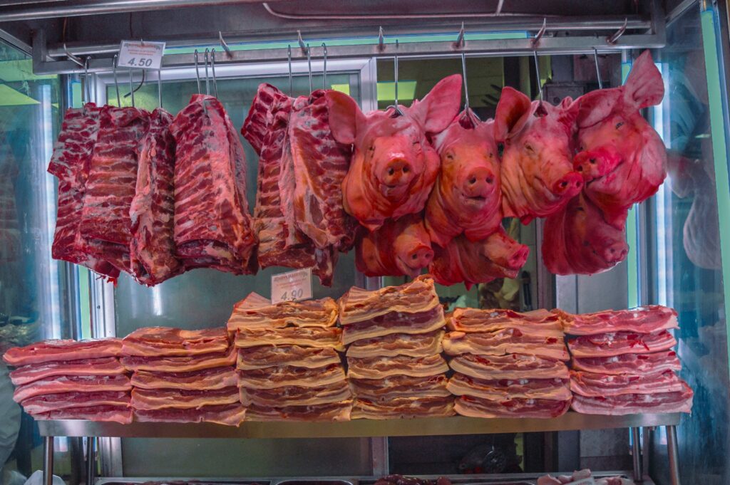Freshly cut pork displayed in a butcher shop.