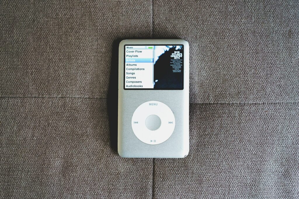 an ipod sitting on top of a couch