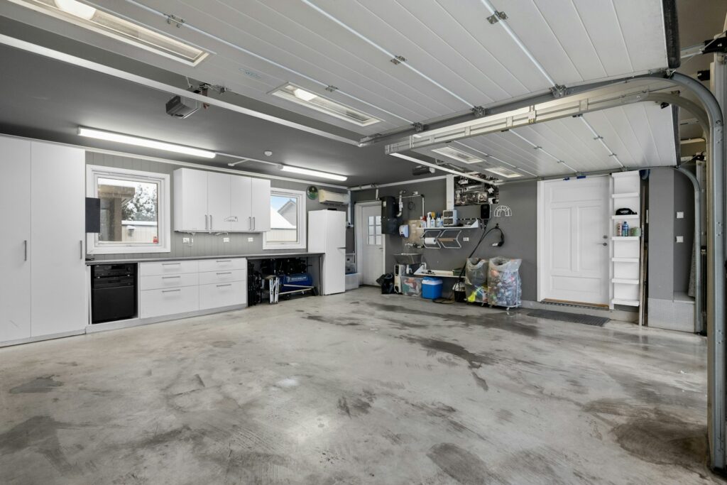A large room with a lot of white cabinets