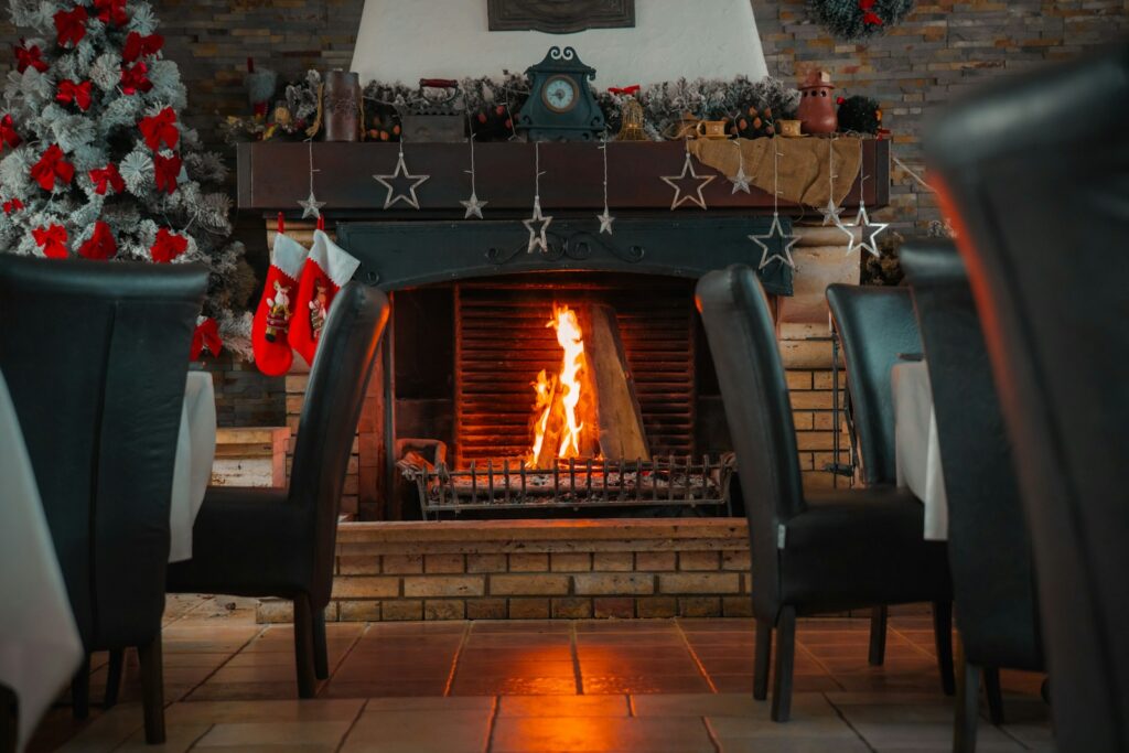 A fireplace in a living room filled with furniture
