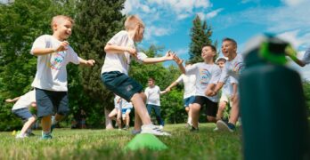 a group of young boys playing a game of frisbee