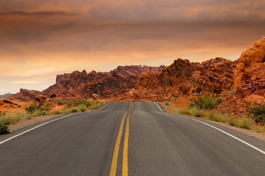 road, sandstone, nature, sunset, pavement, dusk, red rocks, rock formations, rocks, desert, landscape, arid, outdoors, scenic, utah, nevada, usa
