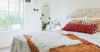 white bed linen on bed