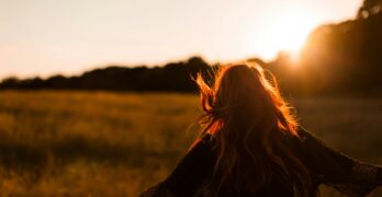 woman standing on grass field