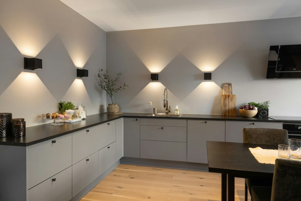 A kitchen with a lot of lights on the wall