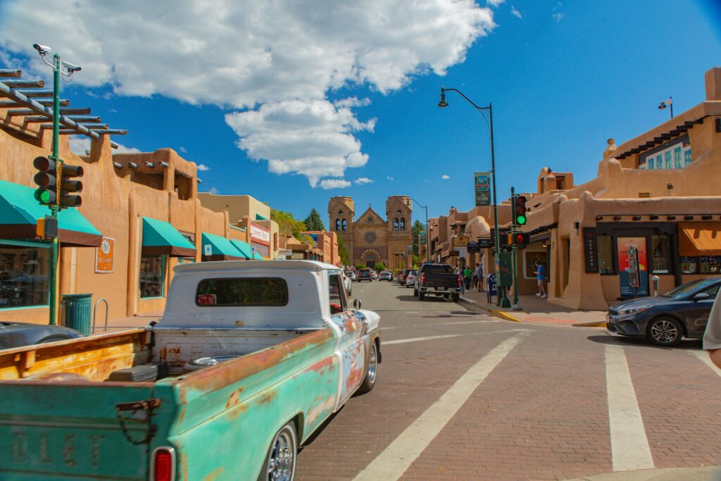 A street with cars parked on the side of it