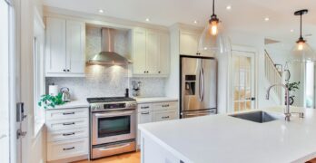white wooden kitchen cabinet and white kitchen counter