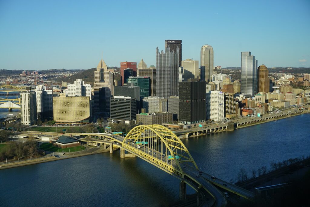 a view of a city and a bridge over a river