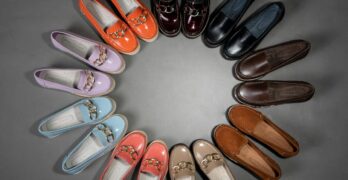 An artistic arrangement of vibrant leather moccasins forming a circle.