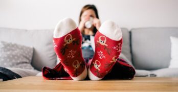 christmas wallpaper, feet, socks, living room, person, relaxing, table, couch, woman, lazy, pajamas, xmas, reindeer, relax, warm, home, sitting, female, human, comfortable, relaxation, cozy