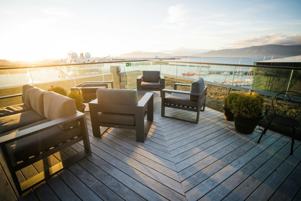 a deck with chairs and tables on it