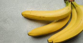 yellow banana fruit on gray table