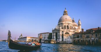 Scenic view of a gondola ride with Santa Maria della Salute in the background, Venice.