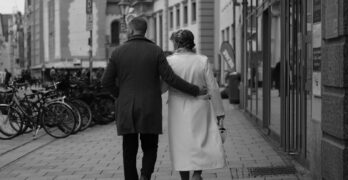 a man and a woman walking down a street