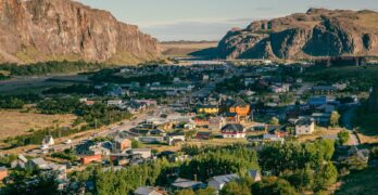 an aerial view of a small town in the mountains