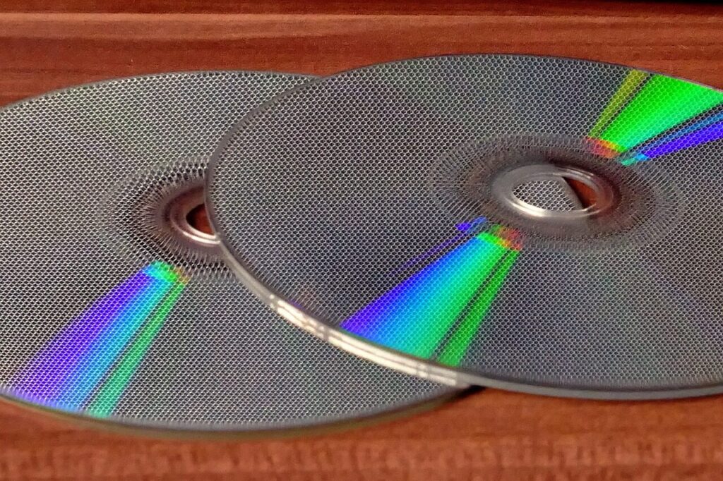 compact discs, cd's, cd, disc, compact, technology, media, data, storage, dvd, computer, music, color, information, circle, audio, cd-rom, burn, recordable, record, optical, rom, digital, backup, software, plastic, copy, memory, gray music, gray data, gray information, gray media, gray software, gray memory, gray circle