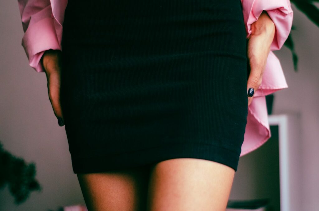 a close up of a person wearing a skirt