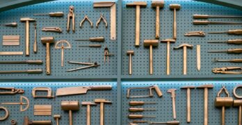 Collection of various brass woodworking tools displayed neatly.