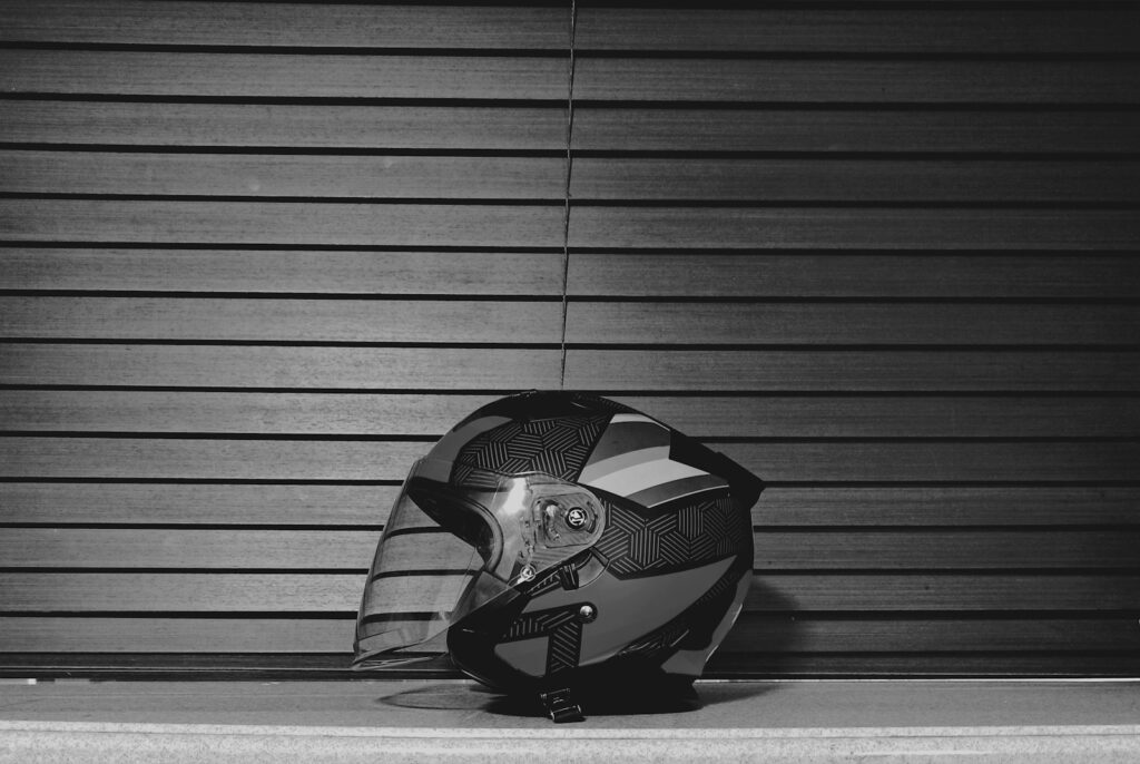 a black and white photo of a motorcycle helmet