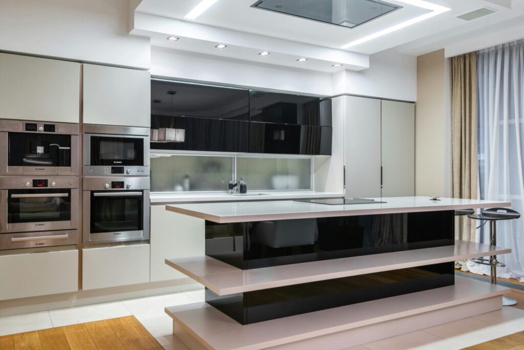 High-end contemporary kitchen featuring sleek design and modern appliances for elegant living.