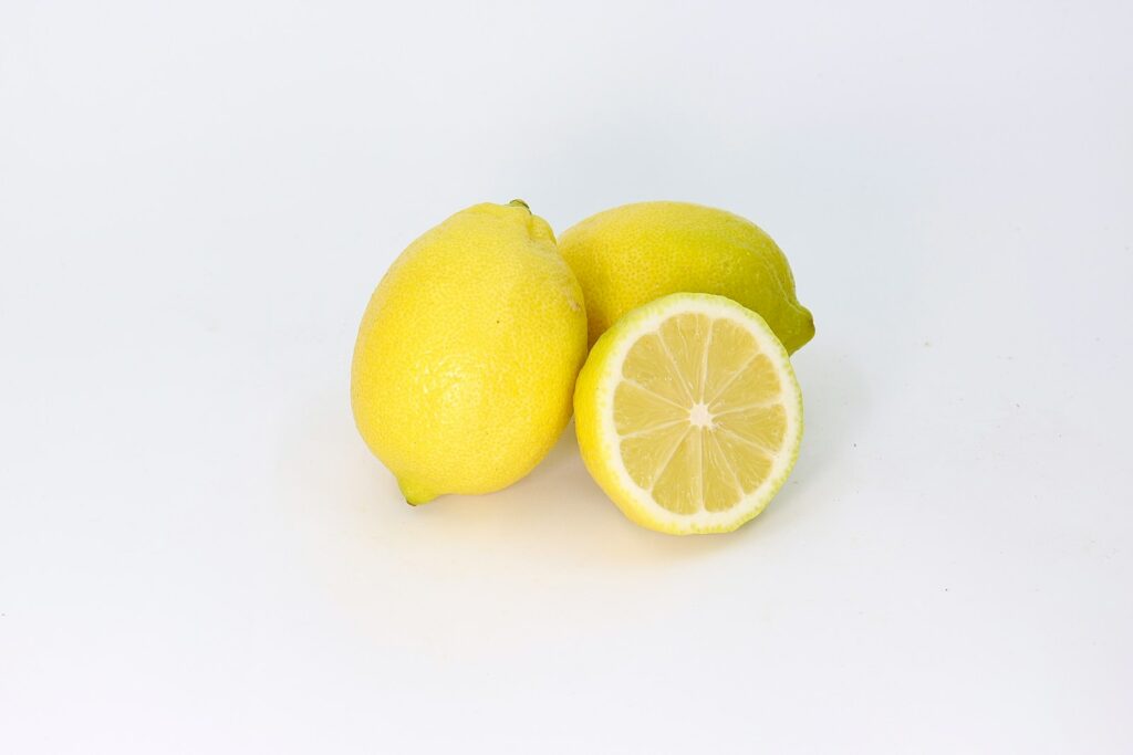 a couple of lemons sitting next to each other