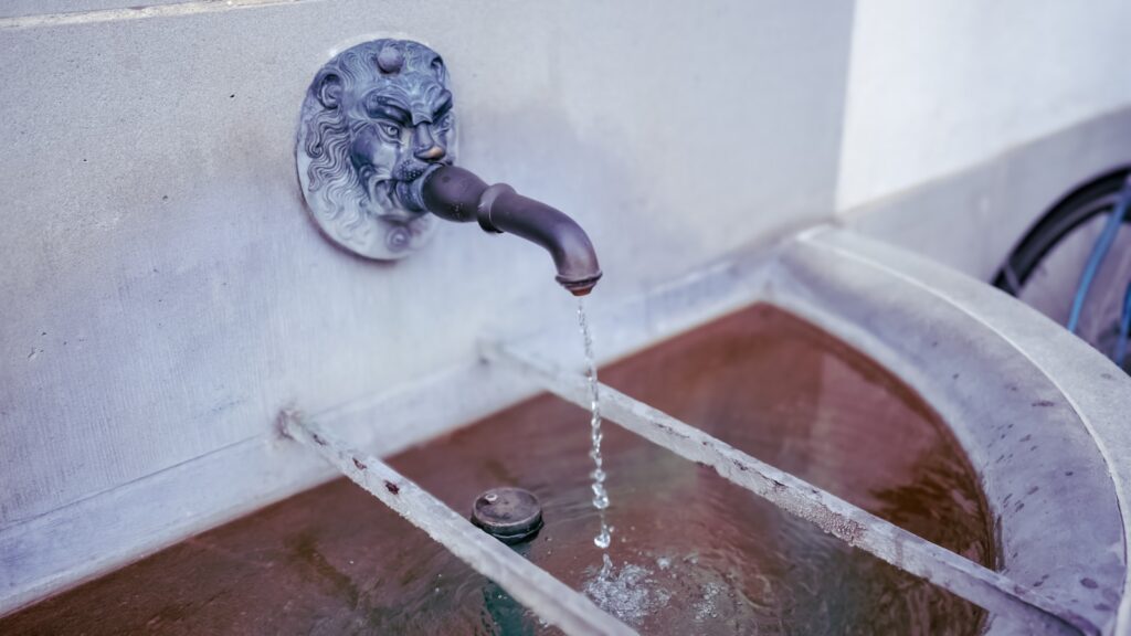 A faucet running from a faucet to a sink
