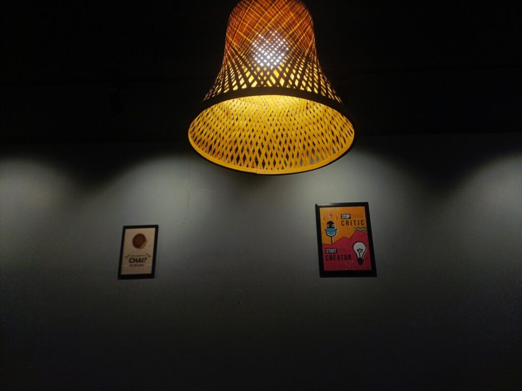 a lamp that is on a wall in a room