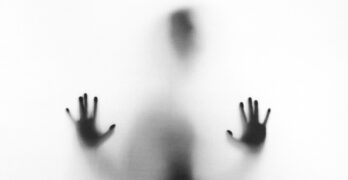 person behind fog glass