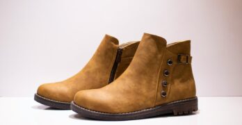 a close up of a pair of brown boots